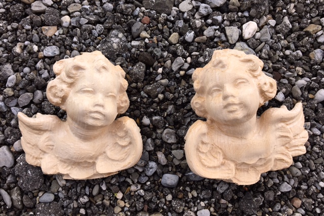 Putti head star putti right, blank for carving