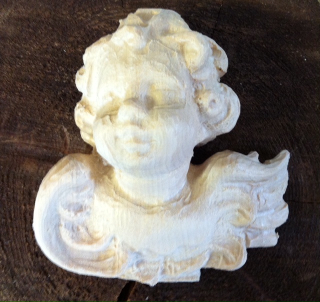 Putti head star putti right, blank for carving